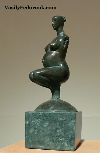Another view of bronze sculpture Pregnancy with greenish tint in the patina and mounted on a small block of green marble.  Artist is the late Vasily Fedorouk from Ukraine.