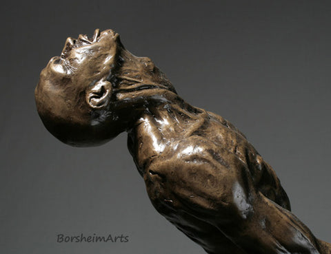 profile detail image of the bronze male figure's head and neck as he leans backwards in his struggle