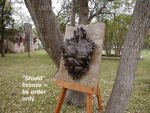 Large man's chest makes a bronze Shield sculpture that may be exhibited inside or out.