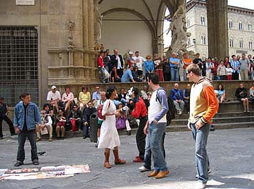 Mime gReY performs in front of the Loggia dei Lanzi in Florence Italy