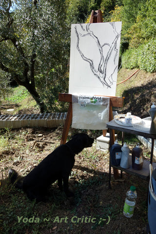 black dog looks at the charcoal drawing on the painting, art critic Yoda in Tuscany?