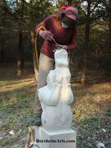 Woman artist Kelly Borsheim carves Marble to create the Gymnast Statue