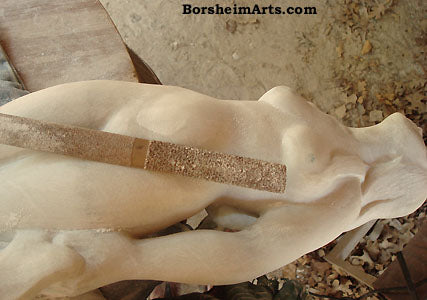 Rasping Marble to remove tool marks and refine the forms Stone Carving