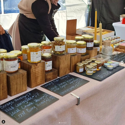 honey for sale on a market stall