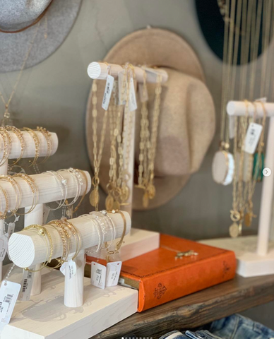 Whitewash wooden jewellery displays in a shop 