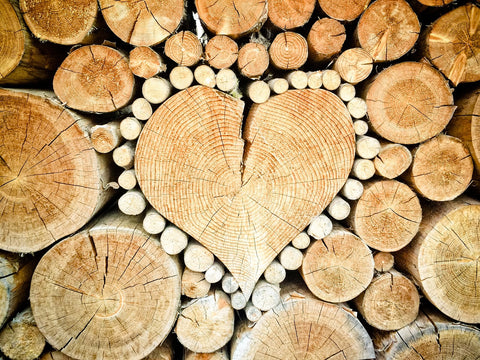 wooden logs in a heart shape