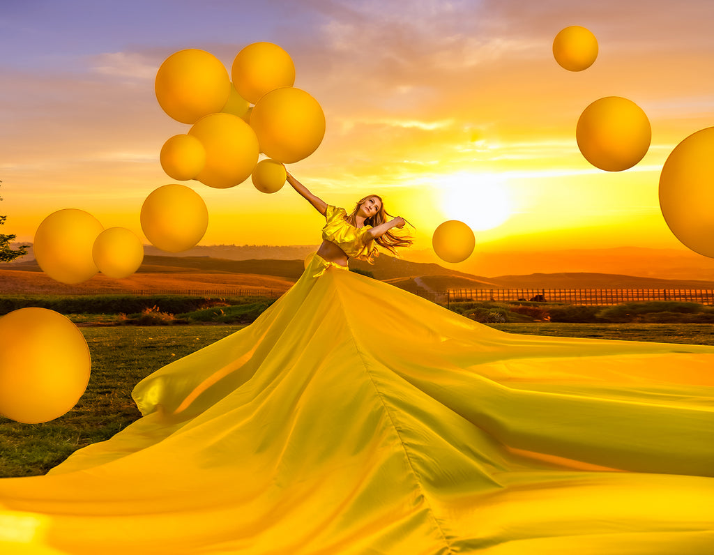 Ellie Burgueno Chico_woman in yellow dress with yellow balloons