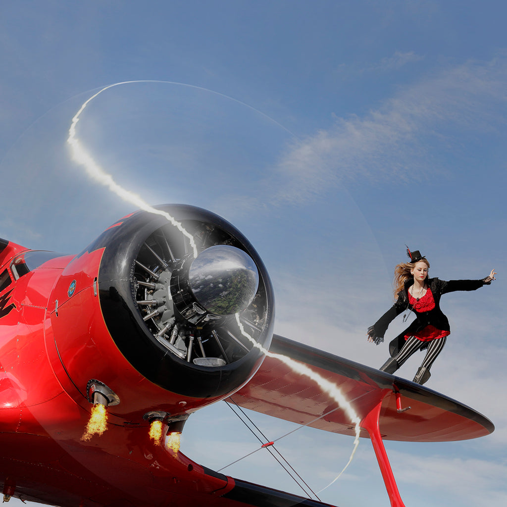Bruce Dorn wingwalker model on wing of red airplane