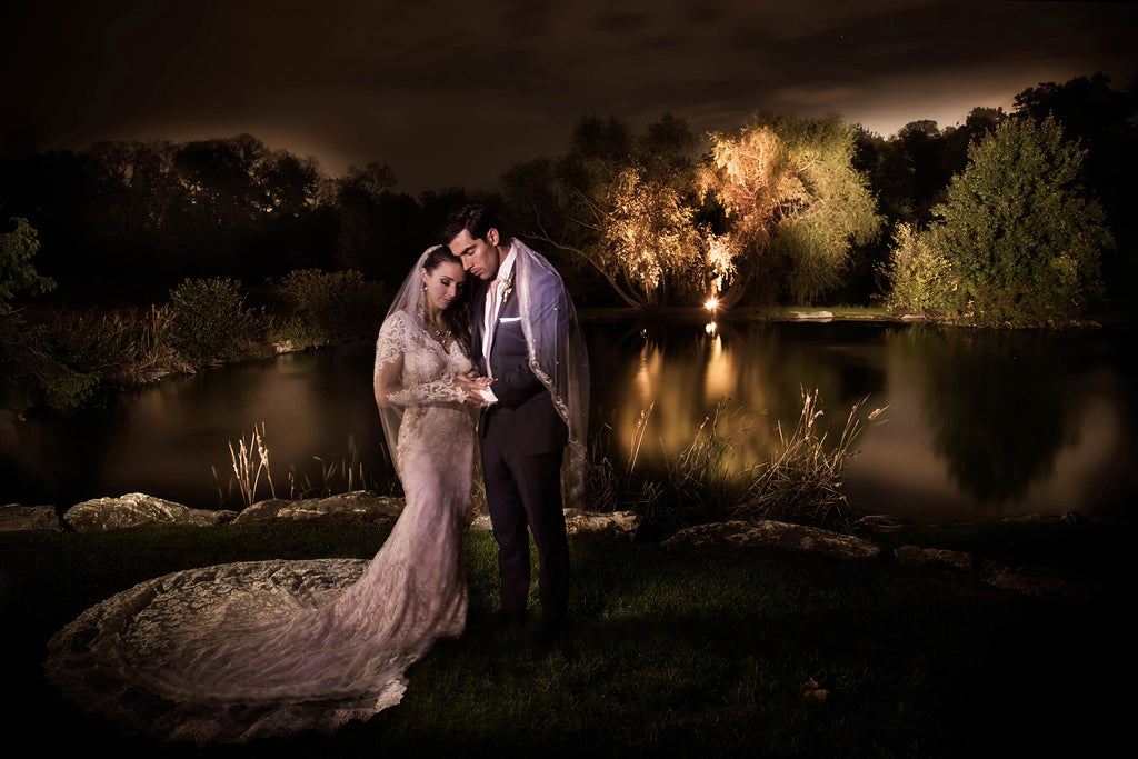 Cliff Mautner portrait of bride and groom on wedding day near pond and trees