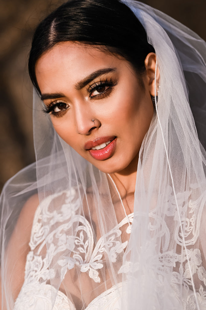 Cliff Mautner portrait of bride in wedding dress and veil lacy top dramatic outdoor lighting