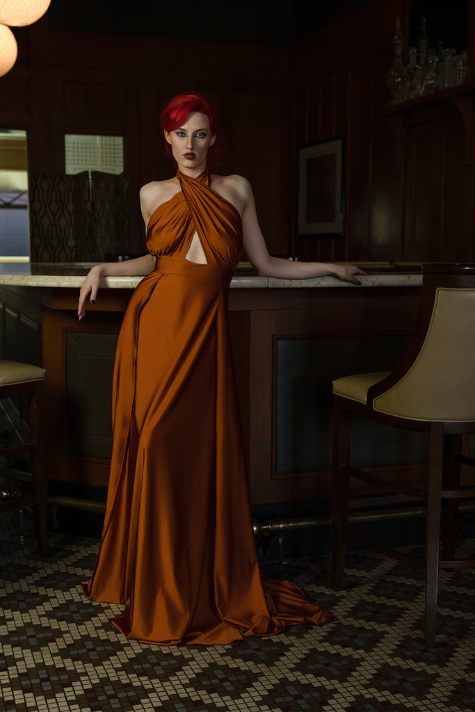 Ric_Lewis_woman in orange brown dress at bar