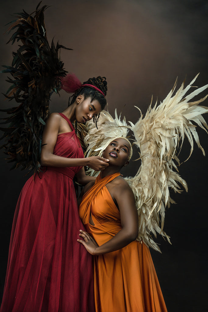 Ric_Lewis_2 women in red and orange dress with wings