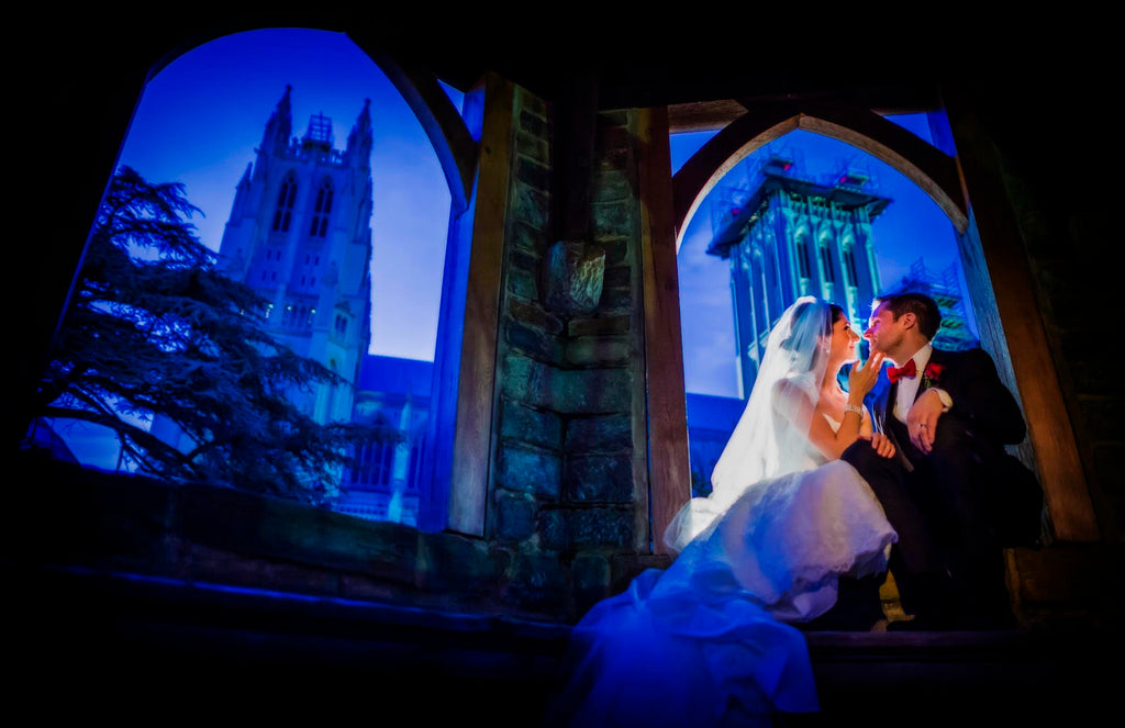 Greg Gibson bride and groom at night National Cathedral archways