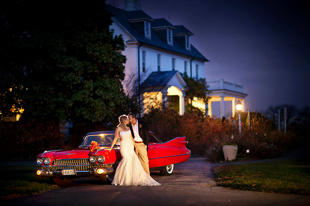 Greg Gibson bride and groom at night with red classic Cadillac