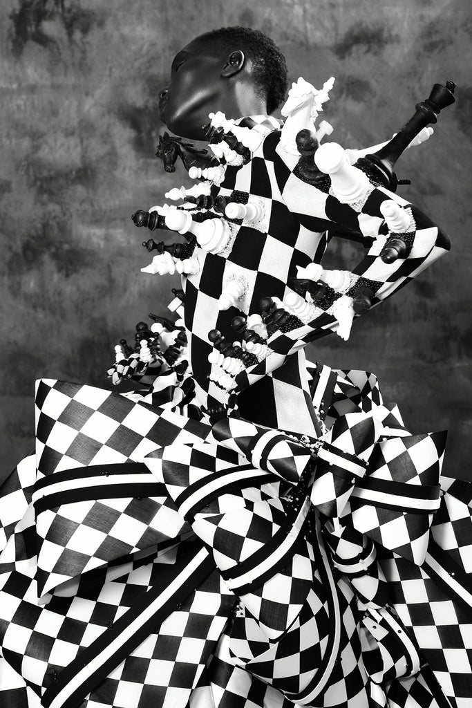 Irvin Rivera black woman wearing chess motif dress
