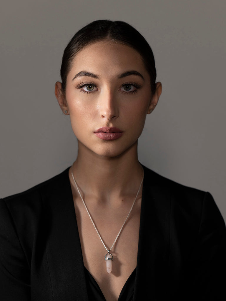 James Schmelzer Portrait of woman with brown hair and crystal pendant