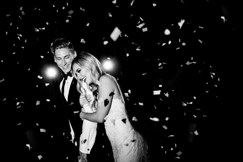 Jason Vinson man and woman celebrating spraying champagne