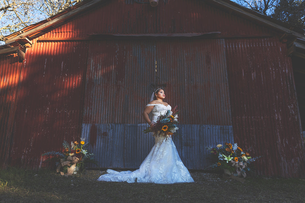 bride in front of barn