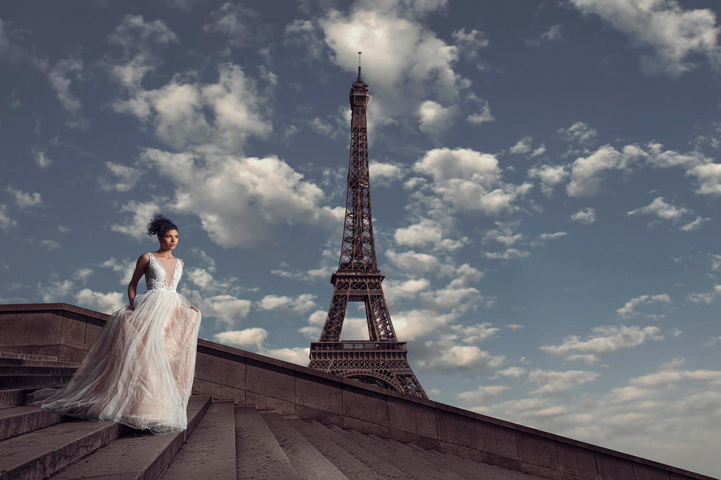 Yuliya Panchenko bride on staircase Eiffel Tower in background