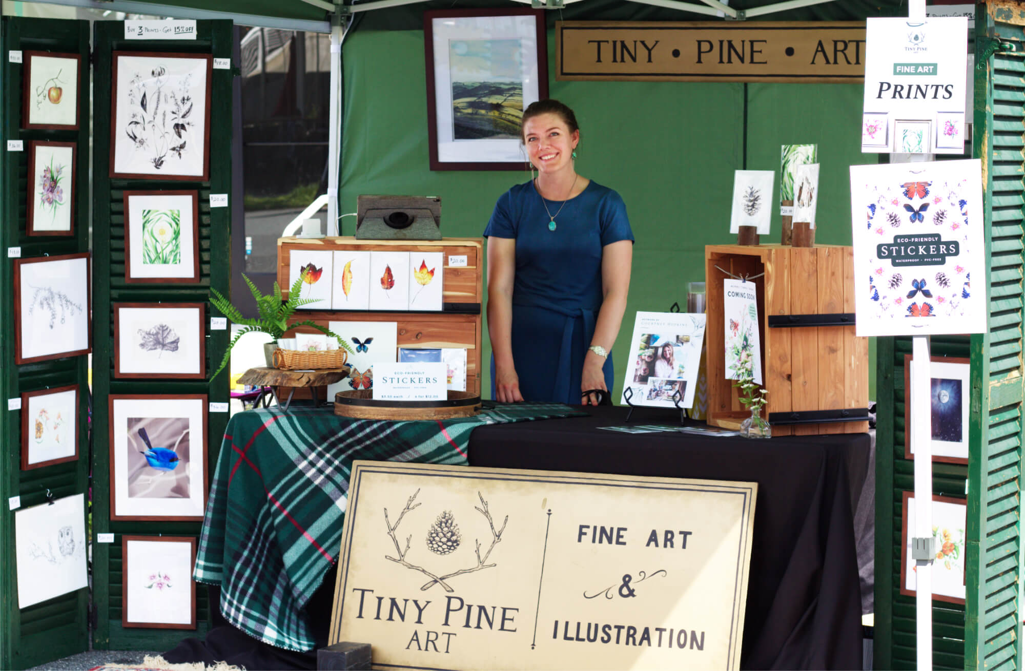 Courtney Hopkins in her Tiny Pine Art booth