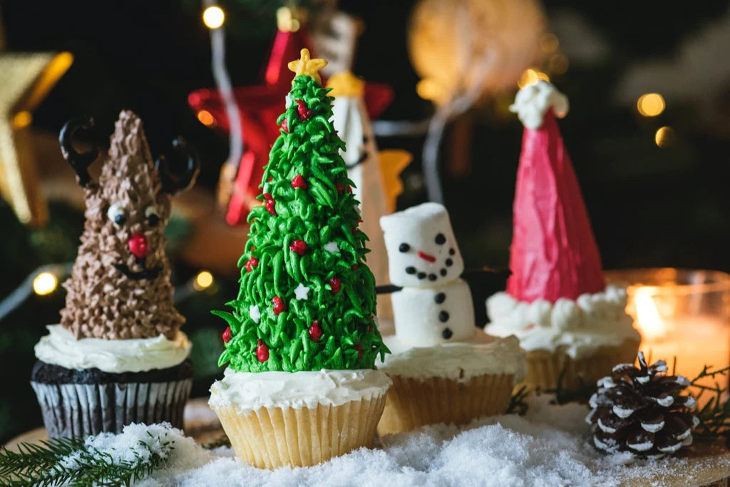 cupcakes with festive iced and chocolate decorations