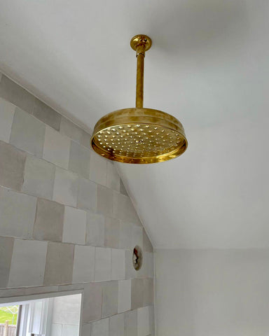 Unlaquered brass showerhead