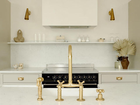 Deck mounted brass tap over kitchen basin