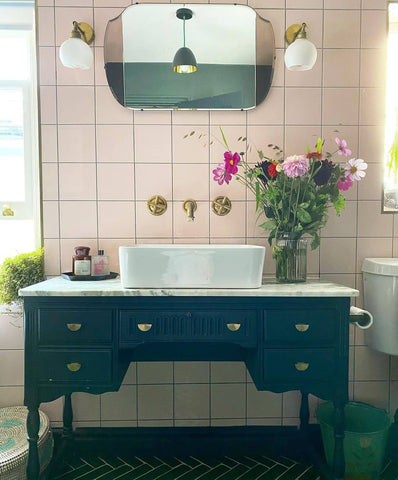 Fresh flowers as a styling idea for a bathroom basin