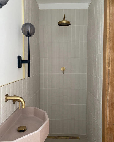 Modern bathroom with brass tapware and shower