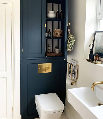 Navy and white bathroom colour scheme with brass