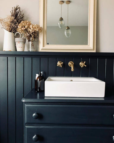 Black and white bathroom colour scheme with brass