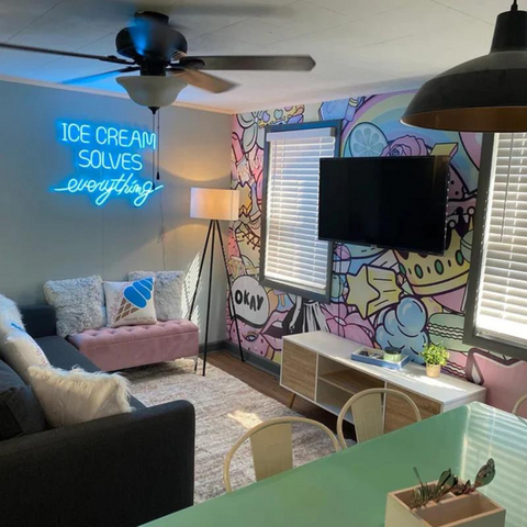 Ice cream solves everything blue neon sign showcased in an individual's kawaii style living room