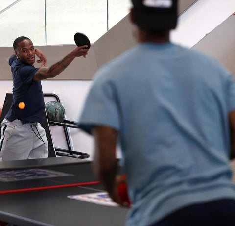 Raheem Sterling battles it out on the table tennis table