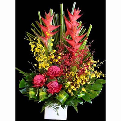Bright colorful tropical flowers arrangement heliconias crab claws red banksias