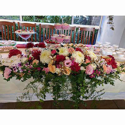 Mothers Day lunch floral long and low table arrangement