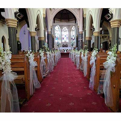 Wedding Ceremony white flowers pew decorations