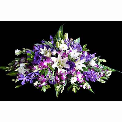 purple orchids lisianthus white lilies flower arrangement