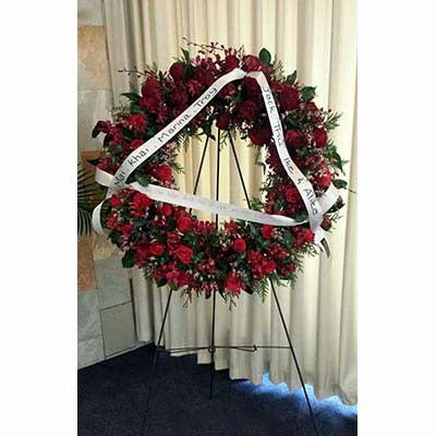 sympathy flowers large wreath on stand red roses orchids