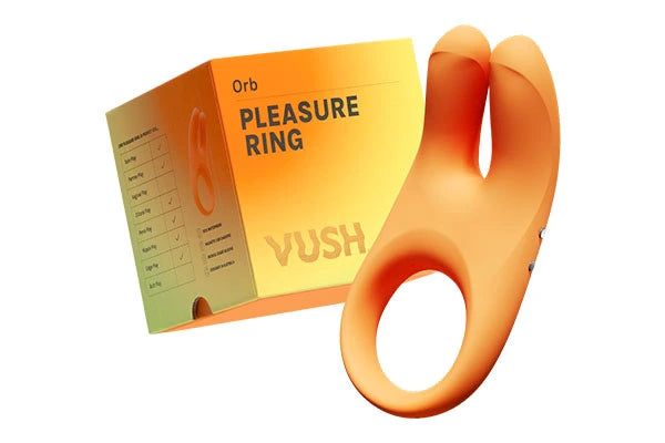 Box with orange/yellow/green gradient and text that reads "PLEASURE RING, VUSH" next to orange cock ring with rabbit ears against light grey background