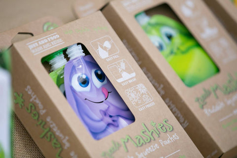 A photo of Little Mashies reusable food pouches in their cardboard box.