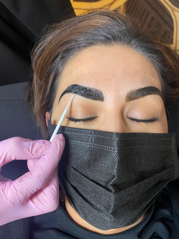 Model's eyebrows going through a tinting beauty service | LashLift Store