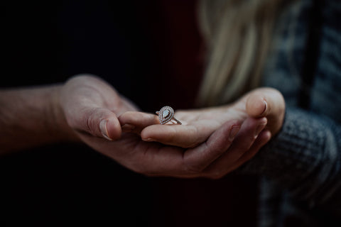 couple engaged wearing a morganite engagement ring