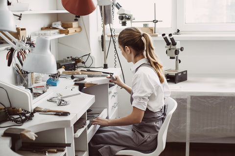 woman cleaning a morganite engagement ring