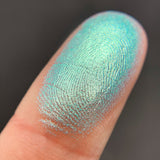 Close up shot of Iceberg eyeshadow swatched on a finger