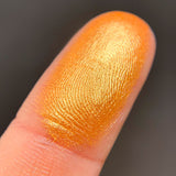 Close up shot of Molten eyeshadow swatched on a finger