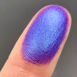 Close up shot of Nocturnal eyeshadow swatched on a finger