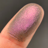 Close up shot of Permafrost eyeshadow swatched on a finger