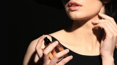 a woman uses fragrance