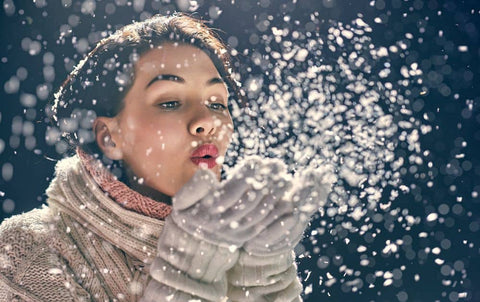 woman blow the snow