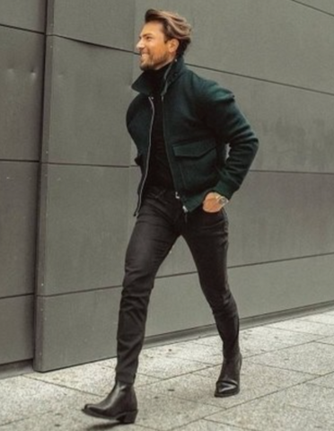 Man in turtleneck bomber jacket jeans boots outfit